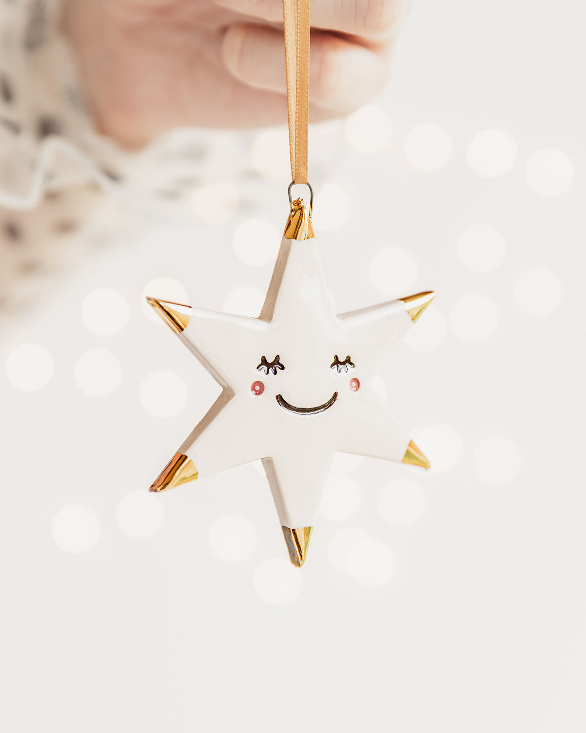 White Star Ceramic Ornament with eyelashes and Gold Tips