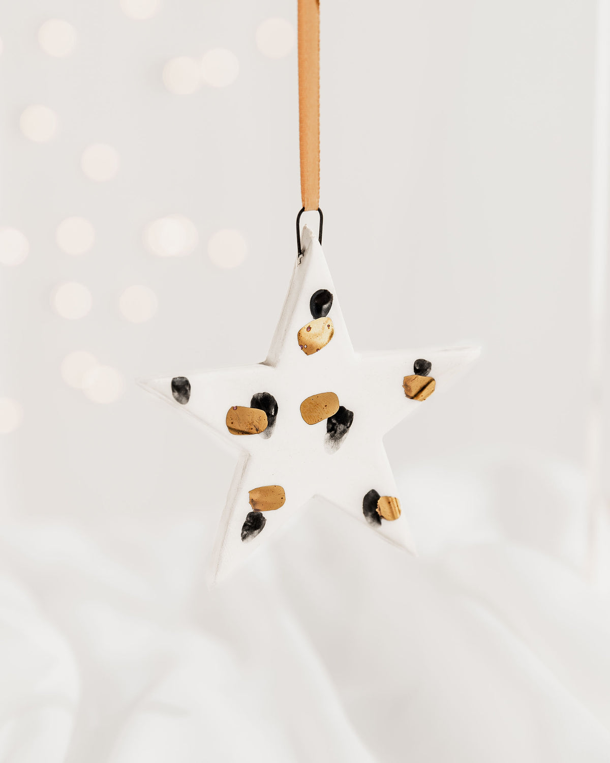 Ceramic Star Ornament with Black and Gold Painted Pattern