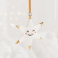 White Star Ceramic Ornament with a smiley face and Gold Tips