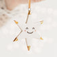 White Star Ceramic Ornament with a smiley face and Gold Tips