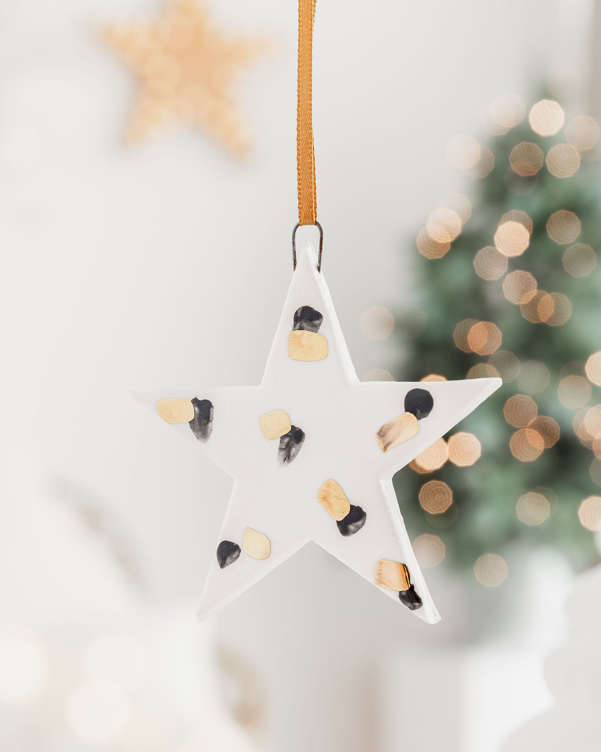 Ceramic Star Ornament with Black and Gold Painted Pattern
