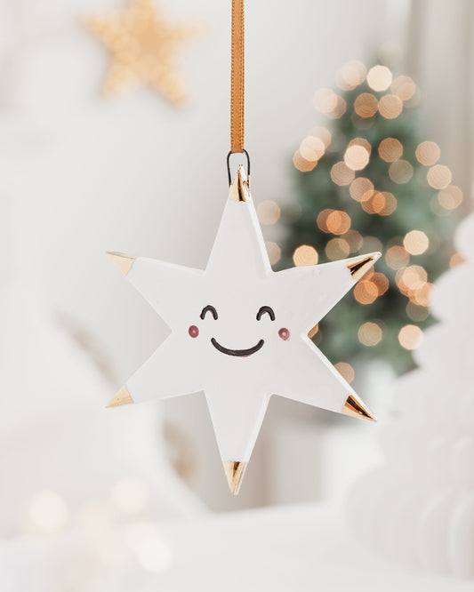 White Star Ceramic Ornament with a smiley face and Gold Tips