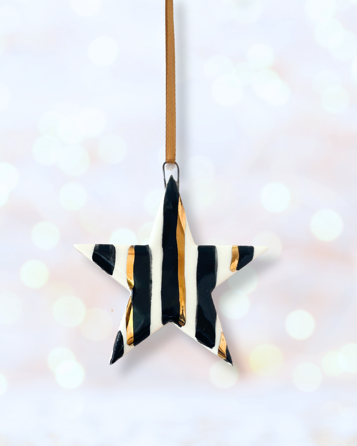 Stripy black and gold star ornament