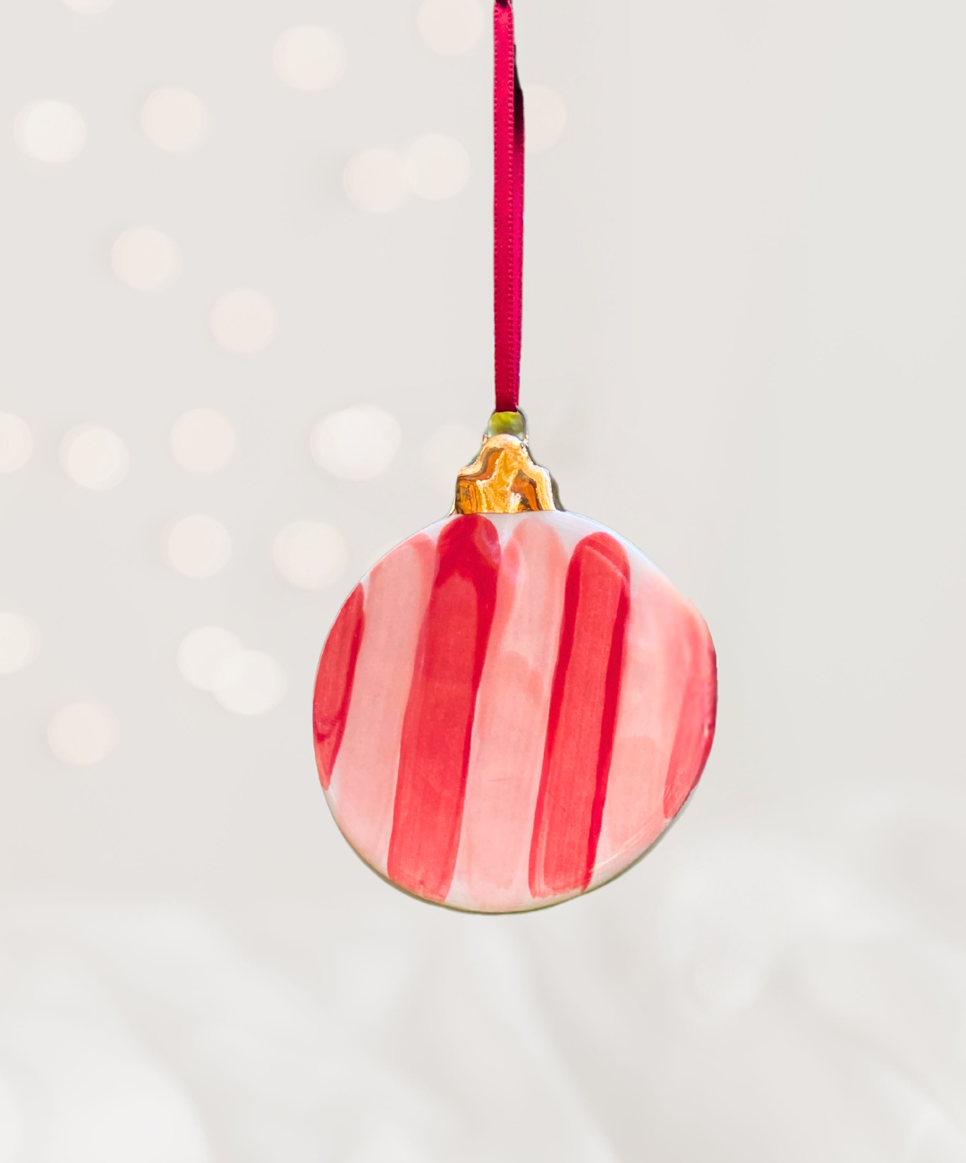 Ceramic Flat Bauble Ornament with Red and Pink Striped Pattern