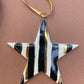 Stripy black and gold star ornament